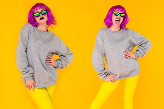 wo lesbian girl in pink wig and rainbow sunglasses posing on yellow background. One of them shows the tongue