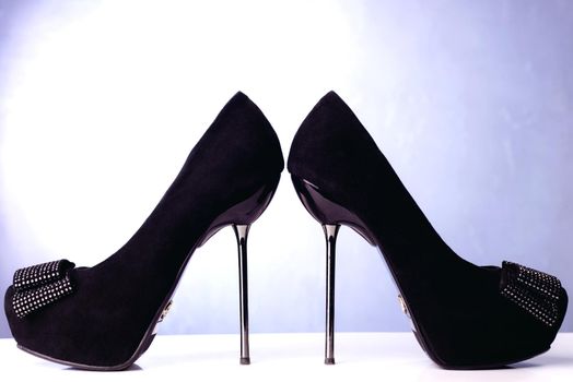 Black high heel women shoes on white background.