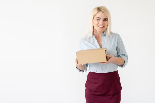 picture of attractive businesswoman delivering cardboard box