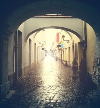 wet empty Kosice street with arches after rain