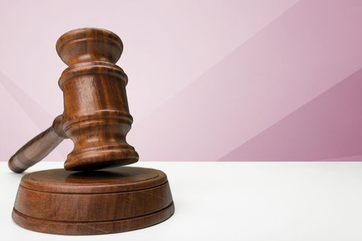 Wooden gavel on table close up. Justice concept