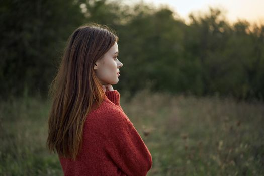 woman outdoors in a field walk fresh air. High quality photo