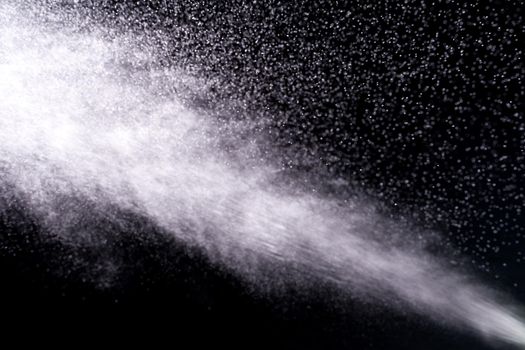 close up of spray water on black background - image