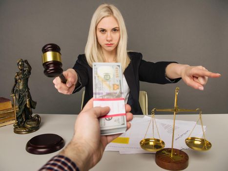 Bribing a young woman judge for a verdict in their favor -image