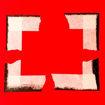 close up of an adhesive tape on red background.