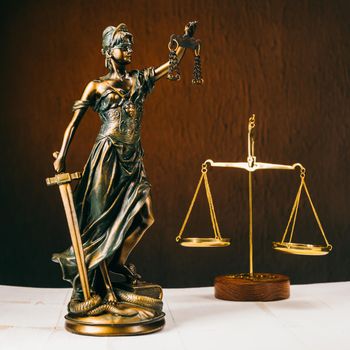 Law offices of lawyers legal statue Greek blind goddess Themis bronze metal statuette figurine with scales of justice. - Image
