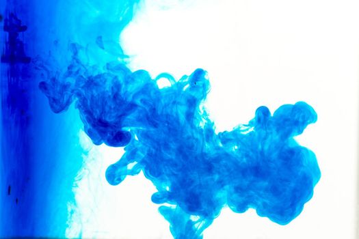 Cloud of ink in water isolated on white. Color of the year 2020. - image