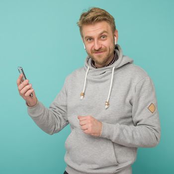 Tula, Russia - May 1, 2019: Happy Man listening music Apple AirPods wireless - Image