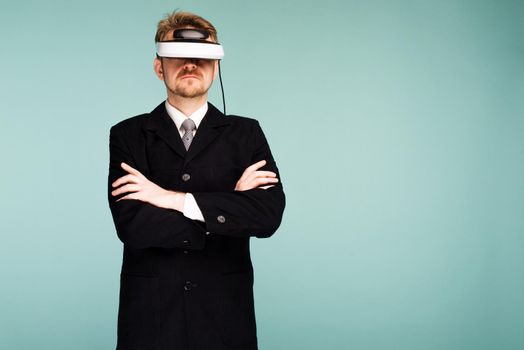 Businessman in a formal wear wearing virtual reality glasses - image