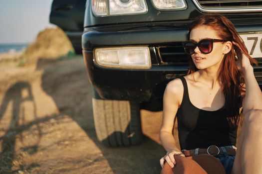 woman in sunglasses near car travel summer vacation landscape. High quality photo