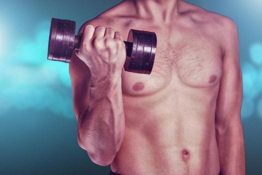 Unrecognizable muscular man lifting dumbbell on blue background with light effect, fitness and healthy lifestyle