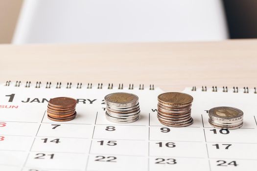The close-up of accounting documents with money coins