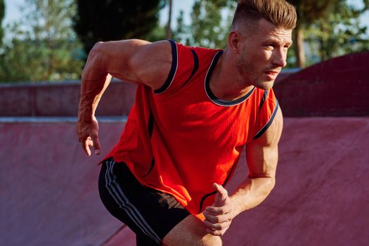 man doing exercises outdoors in the park. High quality photo