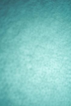 Black leather background with rich texture detail. close-up of black leather. A blurred background.