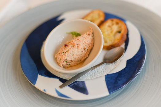 Salmon pate for an aperitif in a French restaurant
