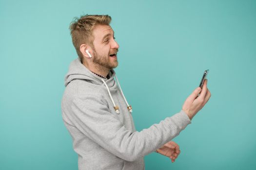 Tula, Russia - May 1, 2019: Happy Man listening music Apple AirPods wireless - Image