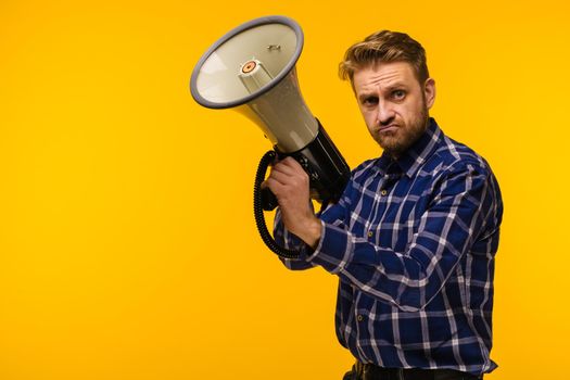 young crazy mad man fool pose with a megaphone. announcement concept - Image