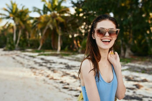 woman wearing sunglasses blue swimsuit island beach sun. High quality photo