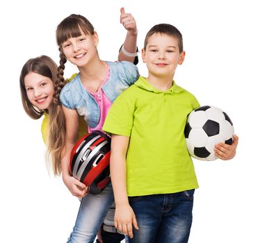 playful schoolchildren holding sport equipment in hands isolated on white background