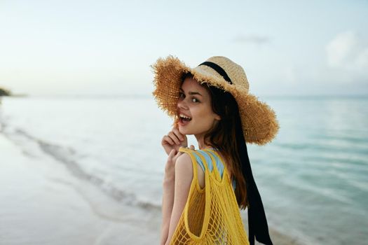 woman in black hat on island landscape ocean nature. High quality photo