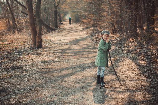 little girl goes through the woods, photo in vintage stylev