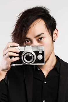 Portrait of happy, smiling man, tourists with camera