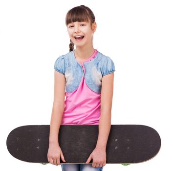 pretty smiling schoolgirl with skateboard in hands isolated on white background