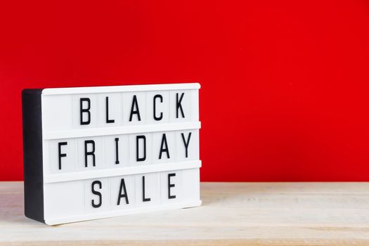 Black Friday concept. Sign on a red background. Place for text.