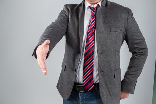 a man gives a hand toward to the camera