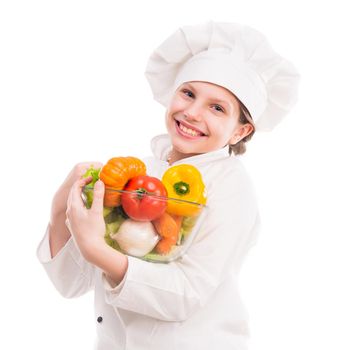 smiling little girl-cook with bowl of vegetables on shoulder isolated on white background