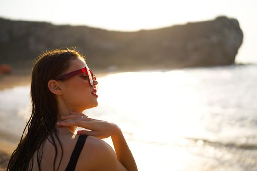 woman in a black swimsuit on the beach sea Summer vacation. High quality photo