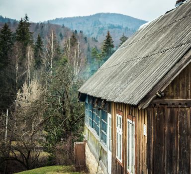 scenic landscape with wooden cabin in Carpathian mountains, Ukraine
