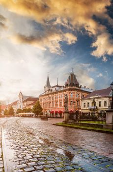 central square in Kosice with tram rails and paving stone after rain