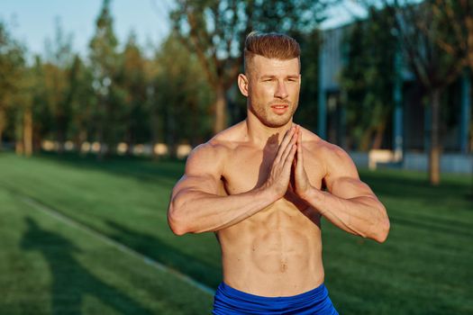 man in the park workout outdoor exercise. High quality photo