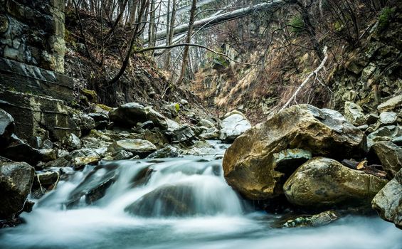 beautiful landscape with mountain clear river flowing over stones