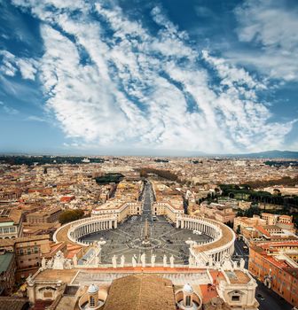 Famous Saint Peter's Square in Vatican and aerial view of the city, Rome, Italy.