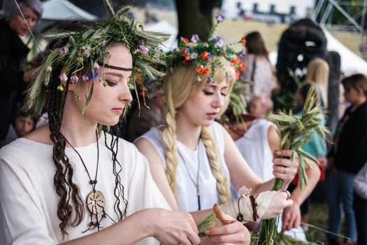 Warsaw, Poland - 20 June 2015: girls with herbal wreaths on midsummer holiday