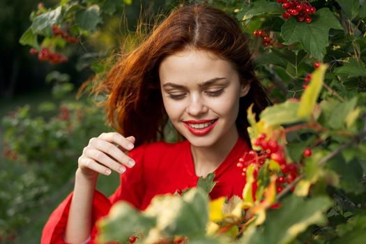 women near bushes nature berries summer lifestyle. High quality photo