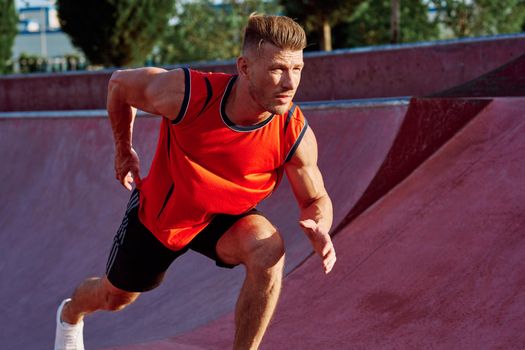 man doing exercises outdoors in the park. High quality photo