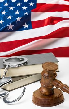 Wooden judge gavel on table, front close-up view