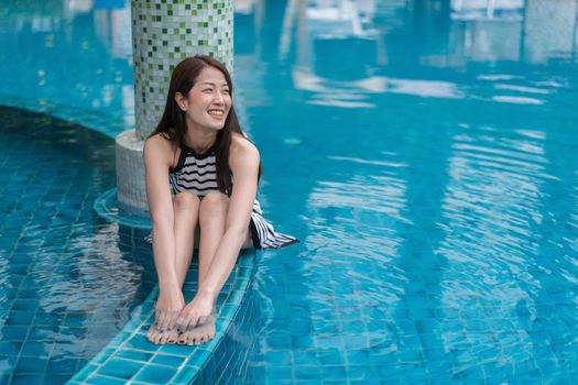 portrait of young woman in the swimming pool