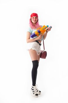 a girl with a water gun in summer clothes, slim and sexy, isolated on a white background drinking coffee