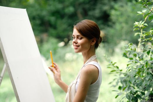 woman artist nature easel drawing creative landscape. High quality photo