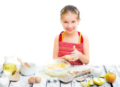 funny little girl making dough on the kitchen