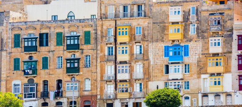 street with colorful balconies in historical part of Valletta in Malta