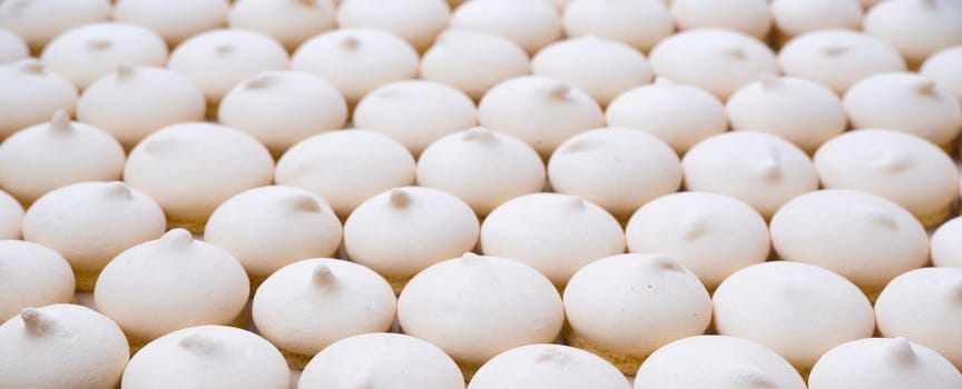 Background of sugar cookies in white glaze, close-up view, shot from above.