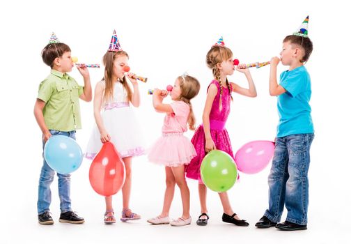 children with birthday hats and baloons using fifes udi