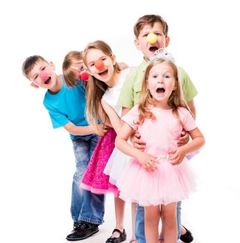 laughing children with clown noses standing one by one and holding each other