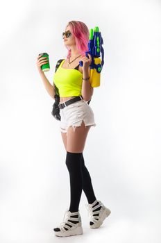 a girl with a water gun in summer clothes, slim and sexy, isolated on a white background drinking coffee