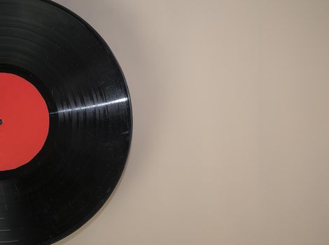 vinyl record on beige background.